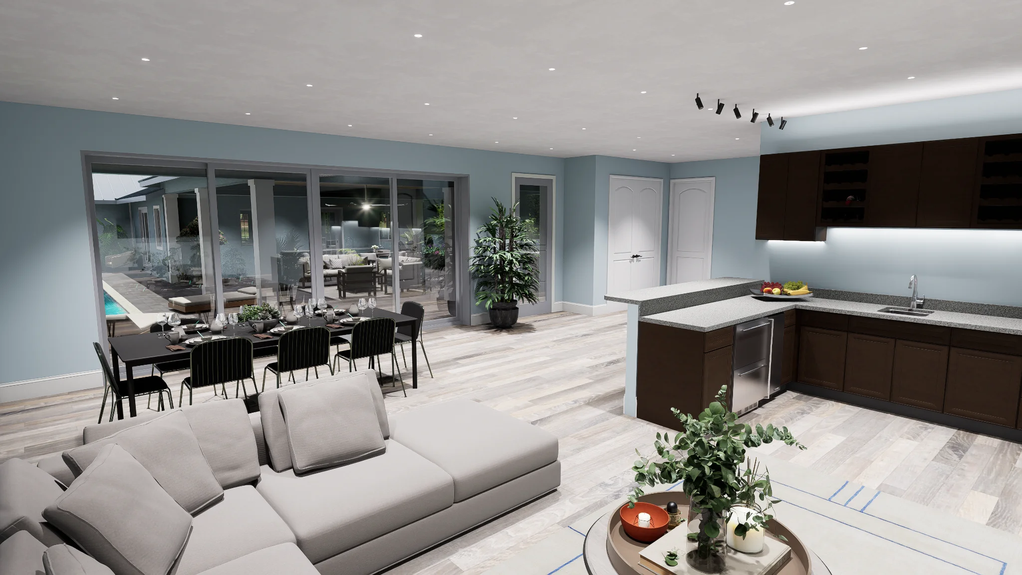Open concept living room and kitchen design with large sliders to patio, dining area, and modern finishes